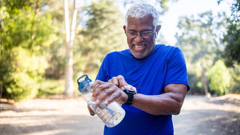 Senior adult using mobility exercises and CBD to stay fit and healthy.