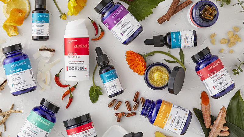 Flat lay of products showing the differences between CBD topicals, capsules & oils