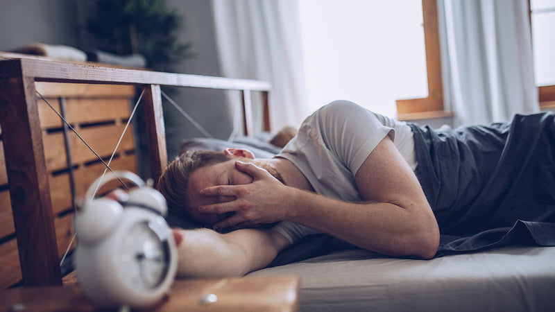 man sleeping better after taking CBN and CBD