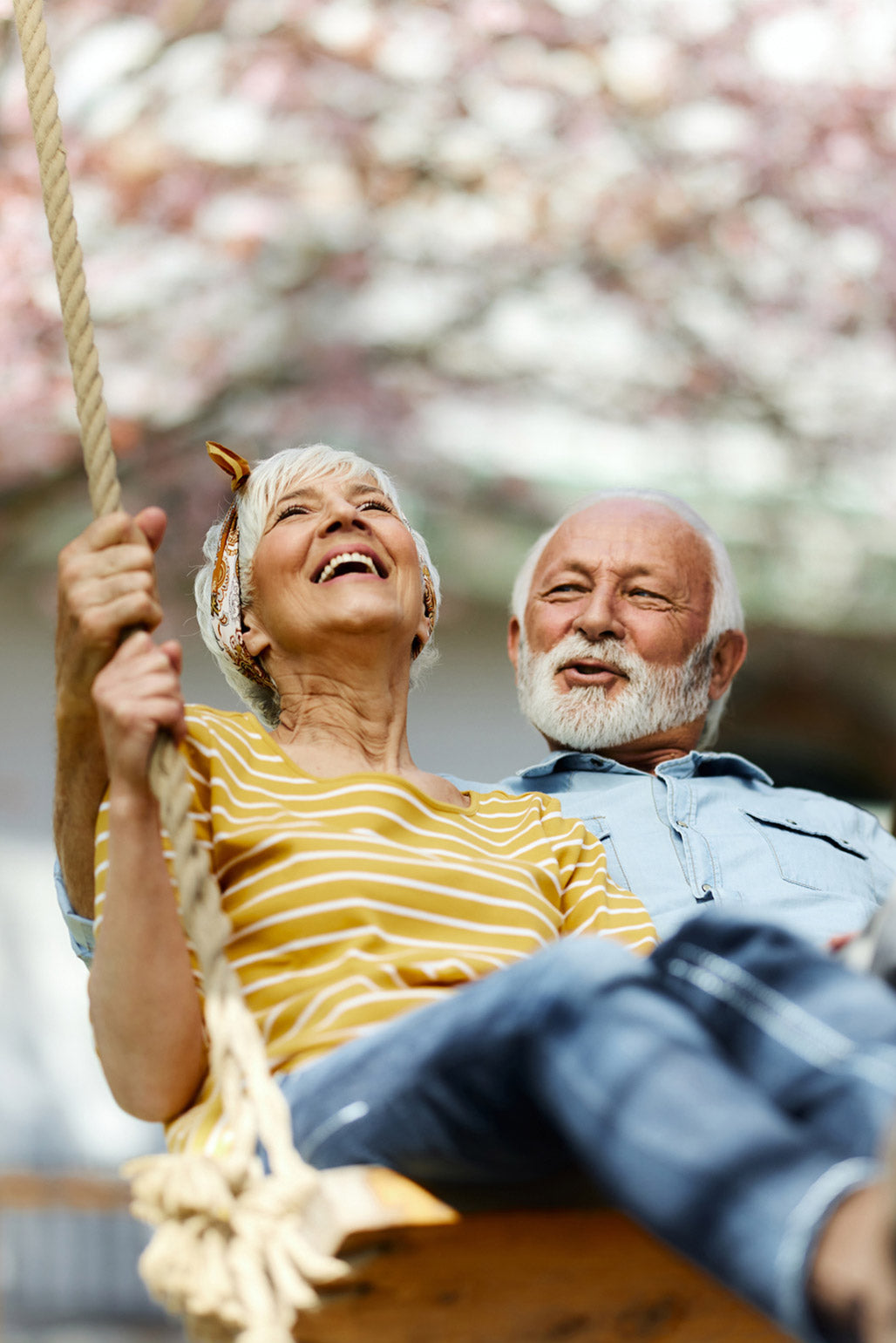 Couple enjoying an swing in the garden